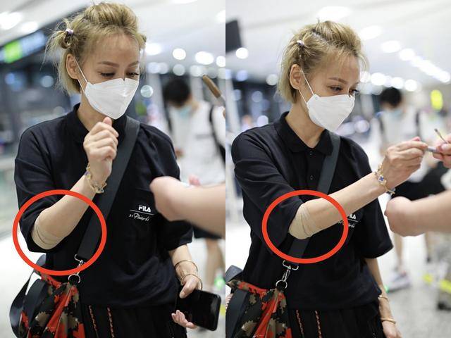 好身材|原创宁静现身机场,穿健美裤秀好身材,高抬腿整理高筒袜不拘小节