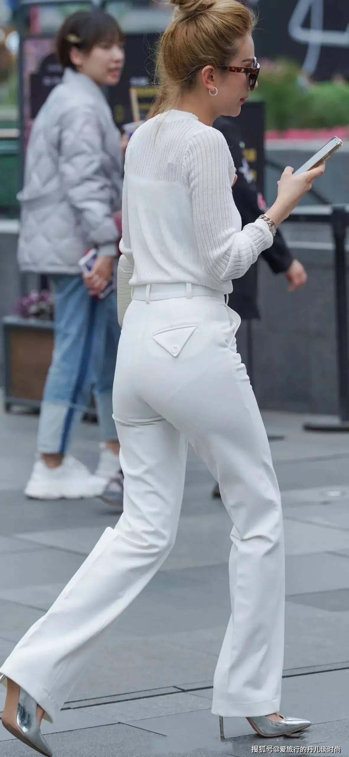 颜色 一身白色装扮的小姐姐,高扎丸子头,清新又干练