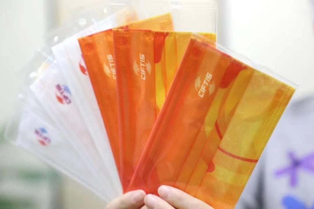 服贸|服贸会口罩不简单！橙黄色系展示中国活力形象